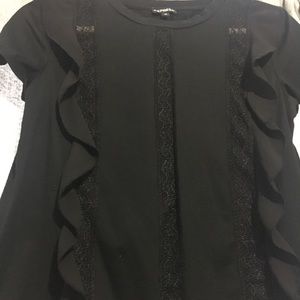 Black T-shirt with ruffle details.
